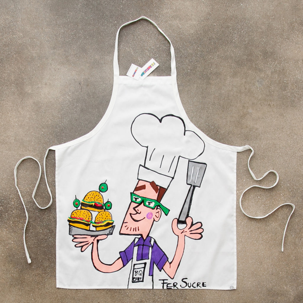 Professional Cotton Apron with Fer Sucre Painting in front. Technique: Acrylic and Plastic May be custom made, please call our Gallery for details. Measurements: 43" x 29"