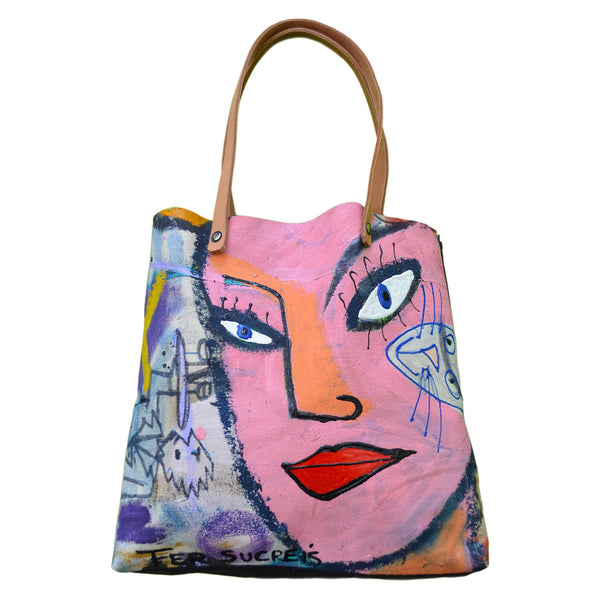 Bette Davies Eyes Pop Bag by Fer Sucre, in collaboration with designer Yaroslava Alonso Limited Edition, handmade, handpainted on canvas front, black leather bottom and back. Brown Leather straps 10" Measures approx 14"x 14" Acrylic and Plastic